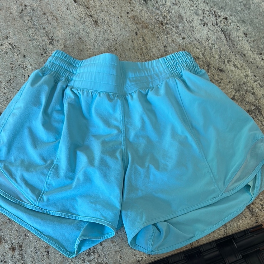 Lululemon 4” hottie hot shirts size 4 but fits smaller after washing